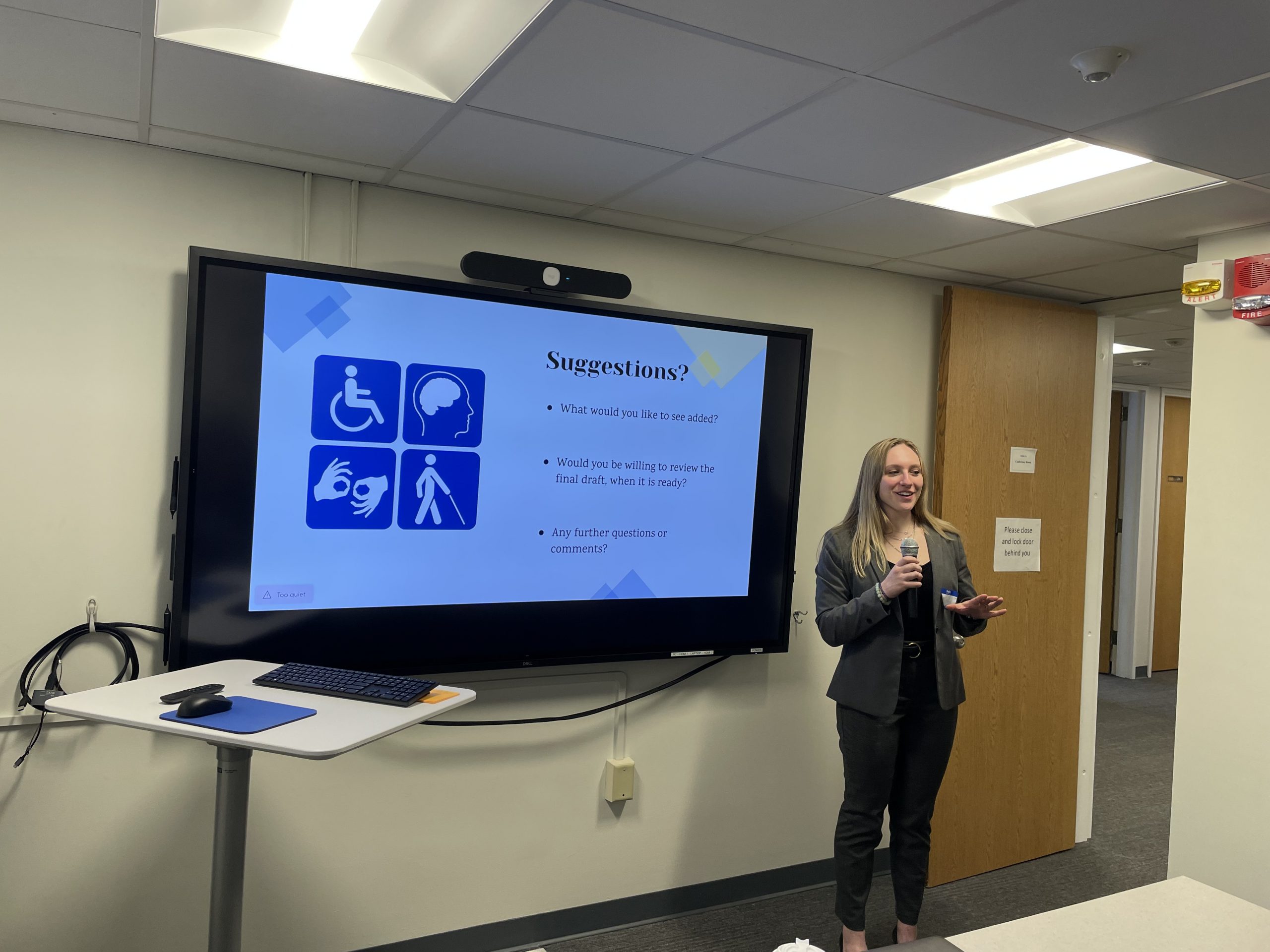 Katharine HLAA A student lab member presents on the ADA Access Guide at an HLAA meeting